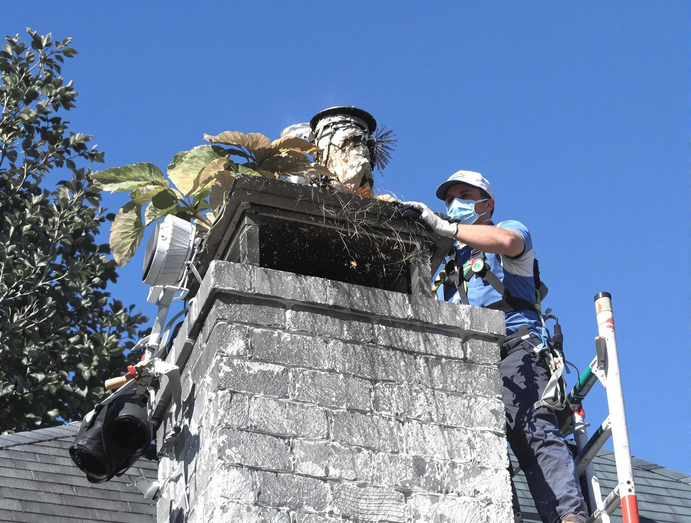 Manalapan Chimney Sweep specialist performing chimney cleaning in Manalapan, NJ